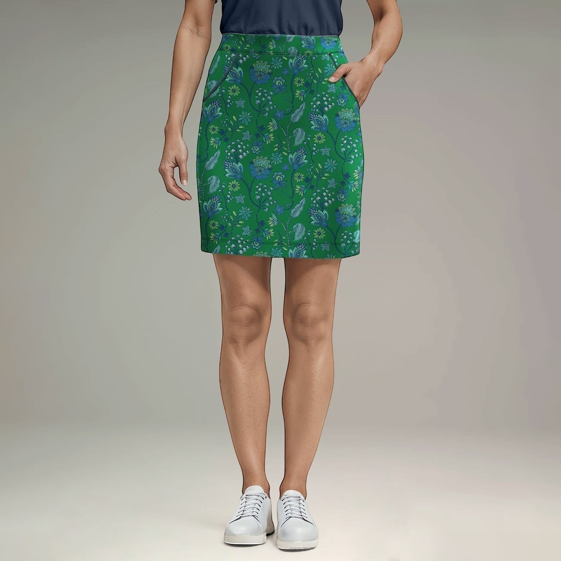 Elliott & Rose Fiori Skort in green with blue floral pattern. Golf skort with pockets, designed for comfort and performance.