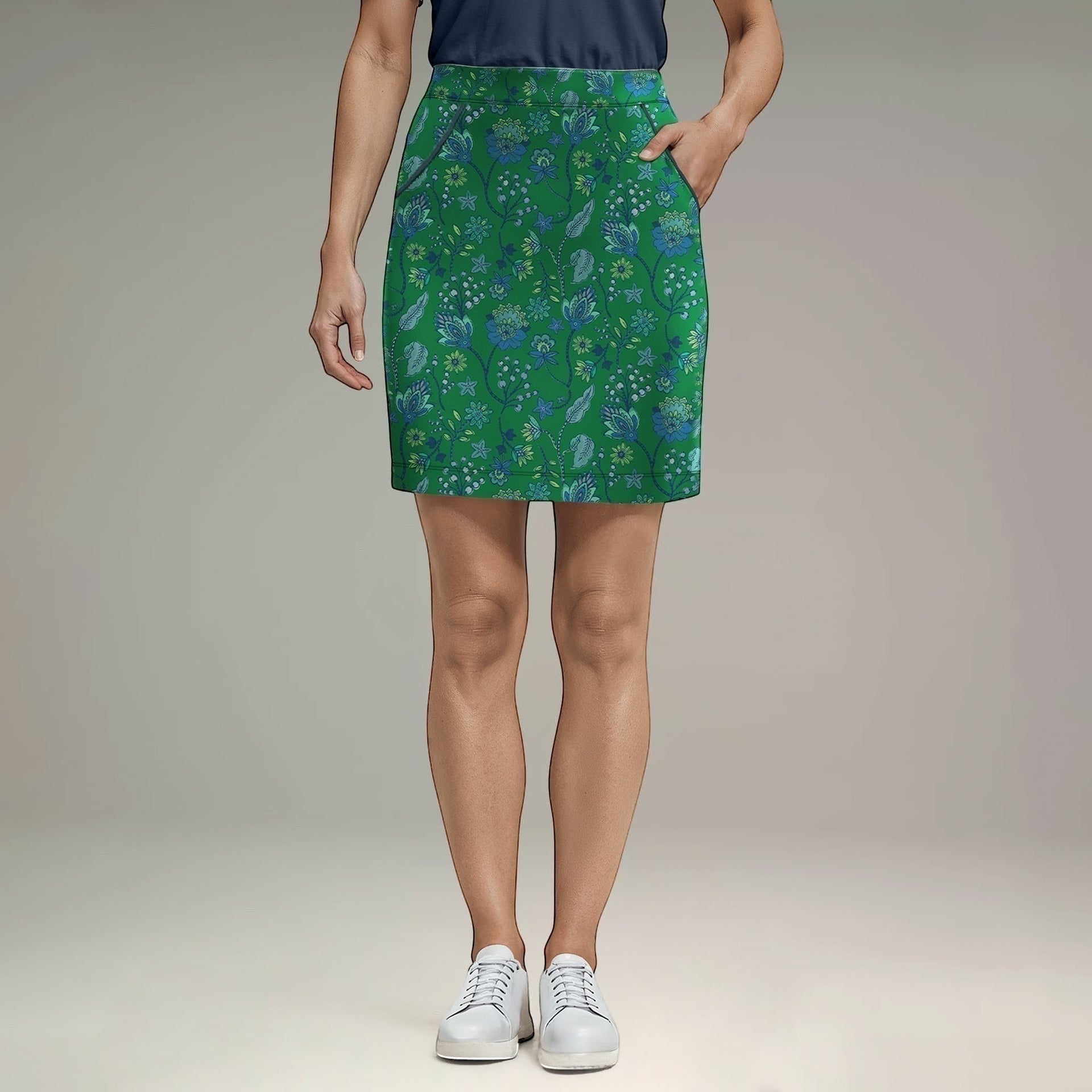 Elliott & Rose Fiori Skort in green with blue floral pattern. Golf skort with pockets, designed for comfort and performance.