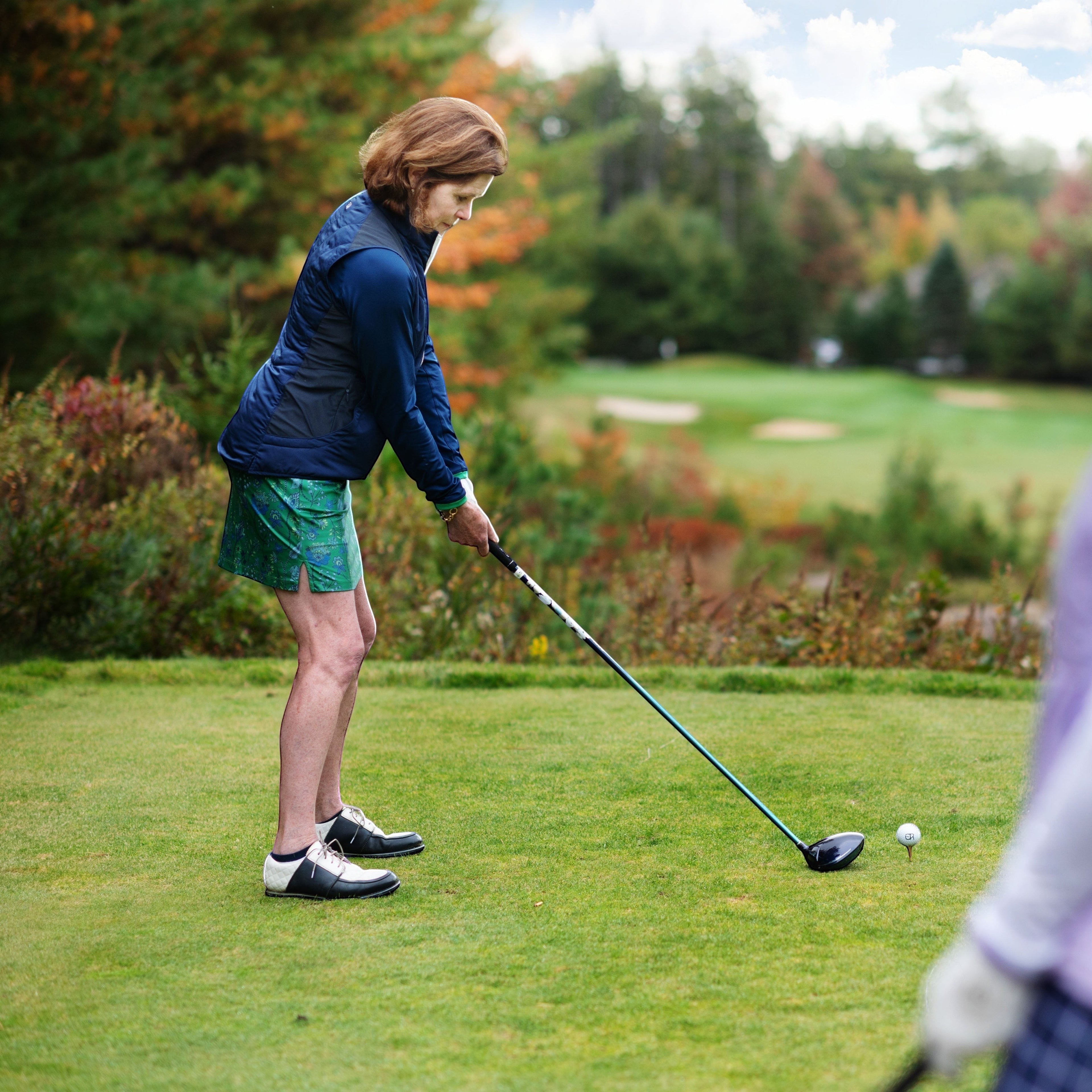 Elliott & Rose Fiori Skort in green with blue floral pattern, designed for golf.