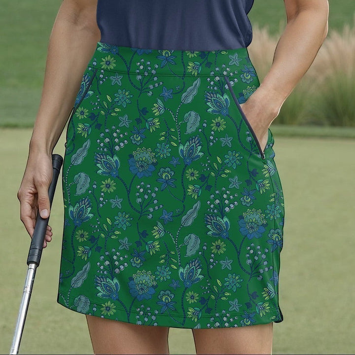 Elliott & Rose green skort with blue and green floral pattern, featuring pockets and a flattering fit for golf.