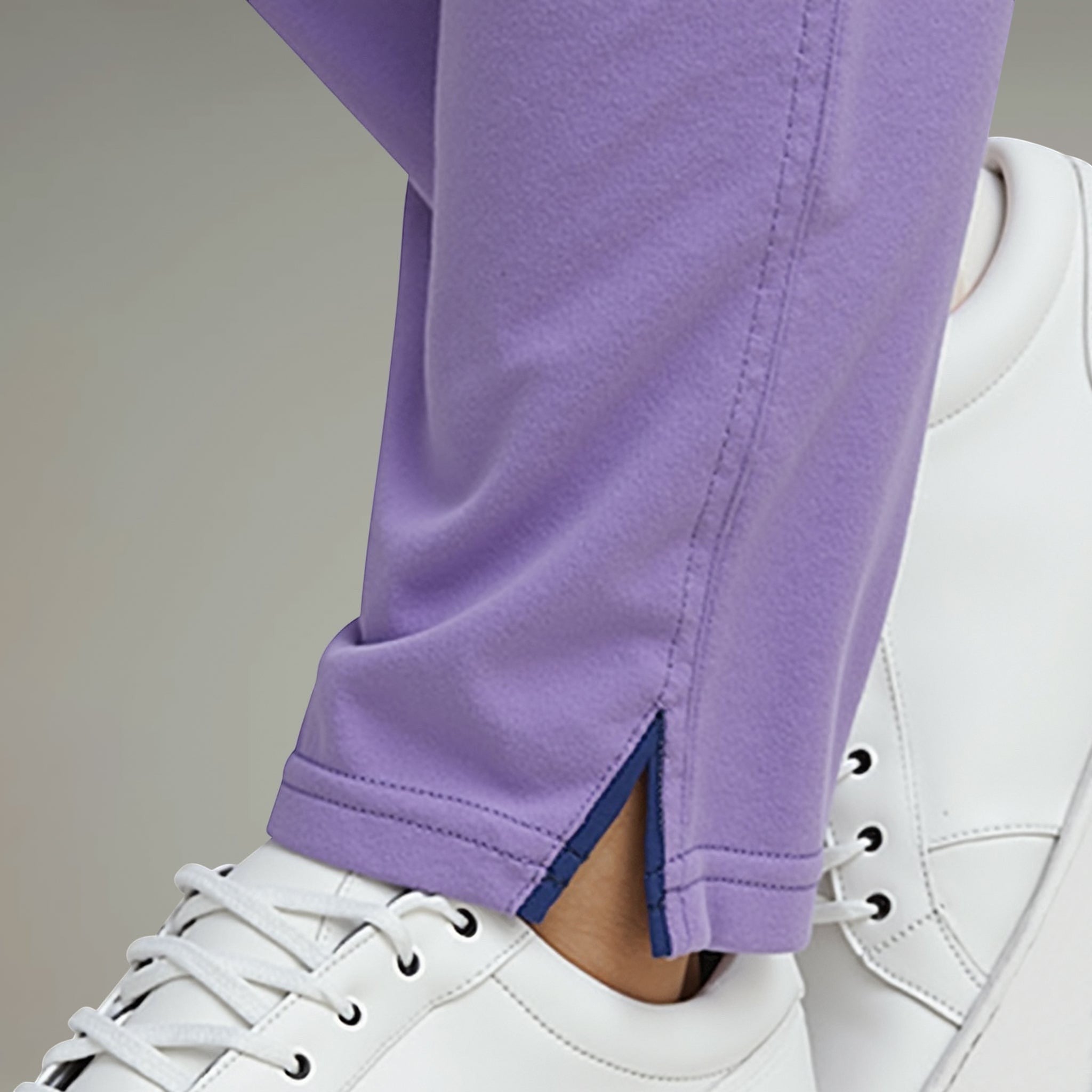 Elliott & Rose lilac performance golf pants with stretch fabric and side slit detail.