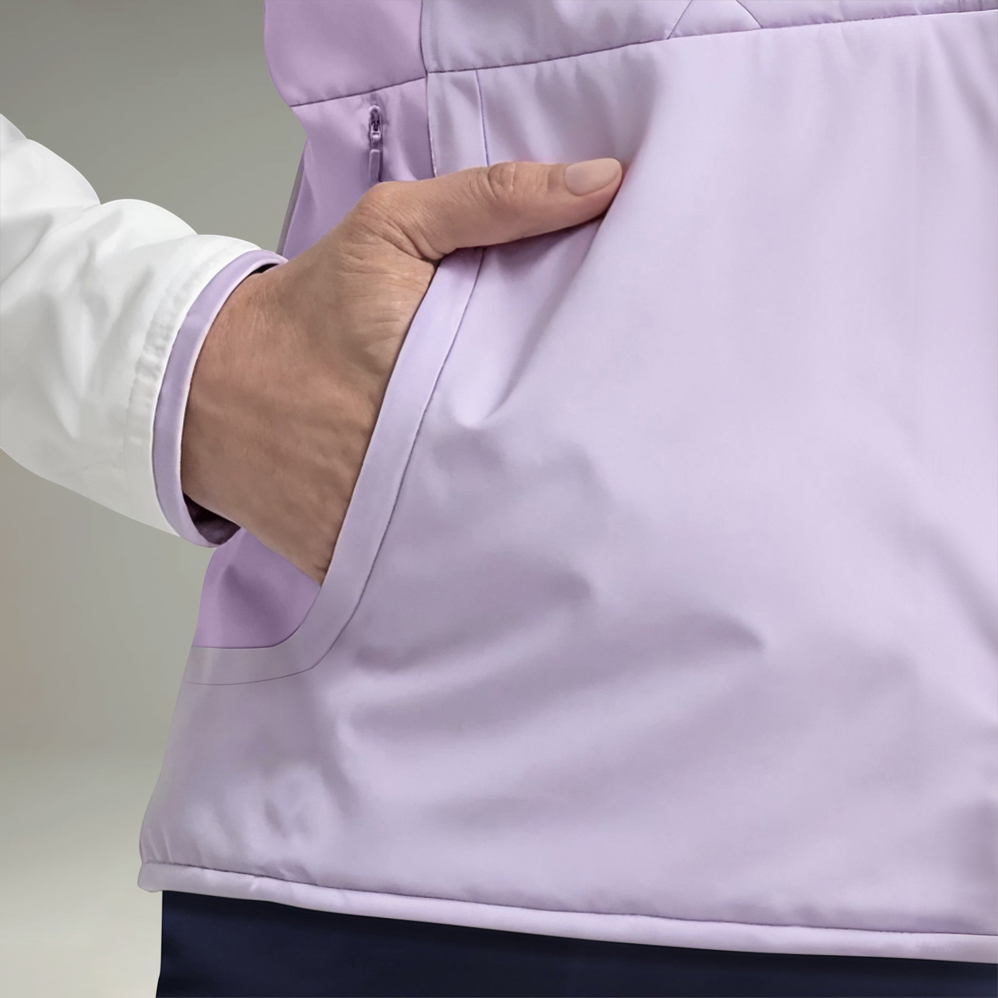 Elliott & Rose women's lilac golf vest with zip pockets and white sleeves, lightweight and comfortable.