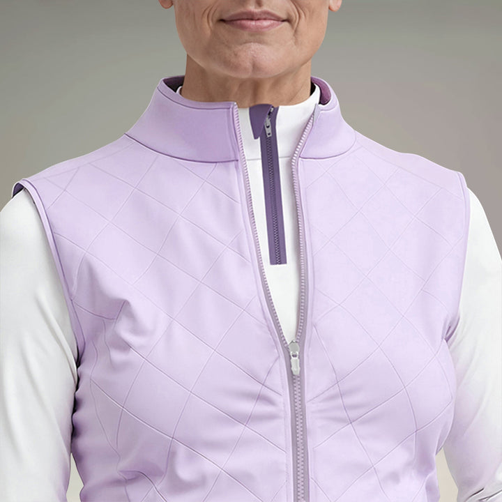 Elliott & Rose women's lilac quilted golf vest with a stand-up collar and full zip closure.