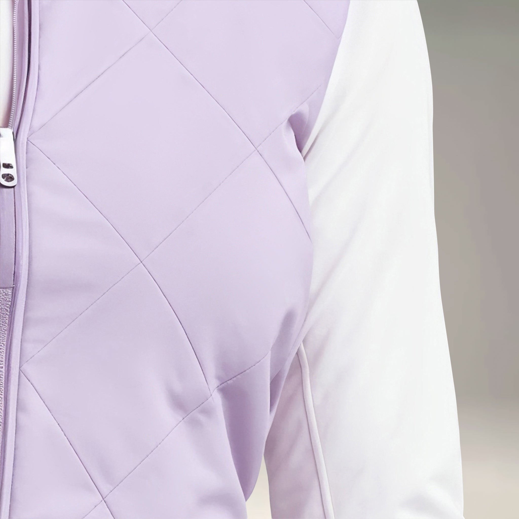 Elliott & Rose lilac quilted golf vest with white sleeves and zipper closure.