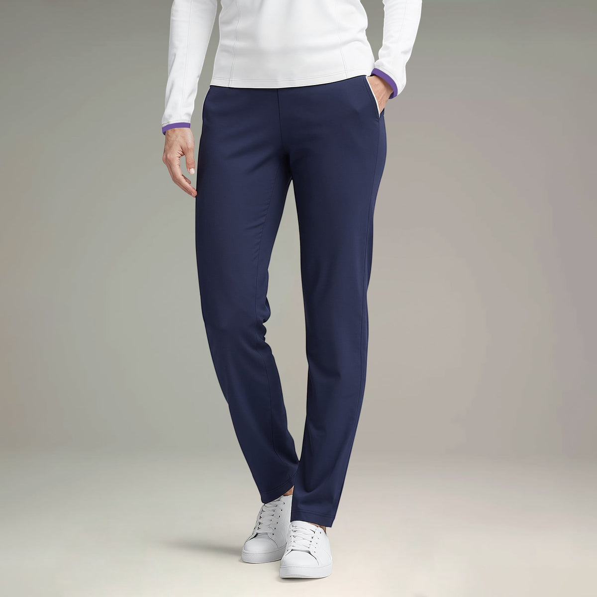 Elliott & Rose navy four-way stretch golf pants with functional pockets and subtle piping detail.