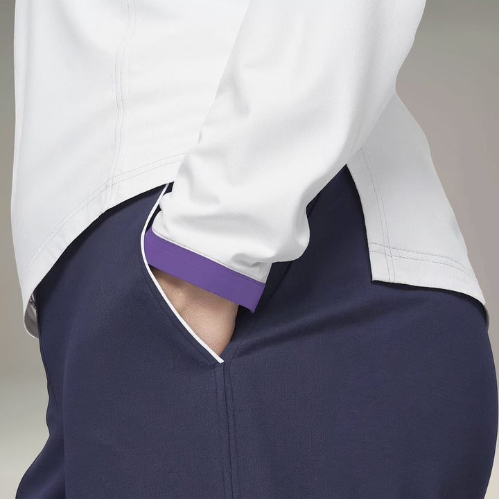 Elliott & Rose navy golf pants with white and purple pocket piping, four-way stretch fabric.