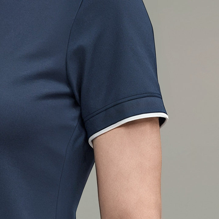 Elliott & Rose navy blue performance golf polo shirt with white trim on sleeves. Moisture-wicking fabric.