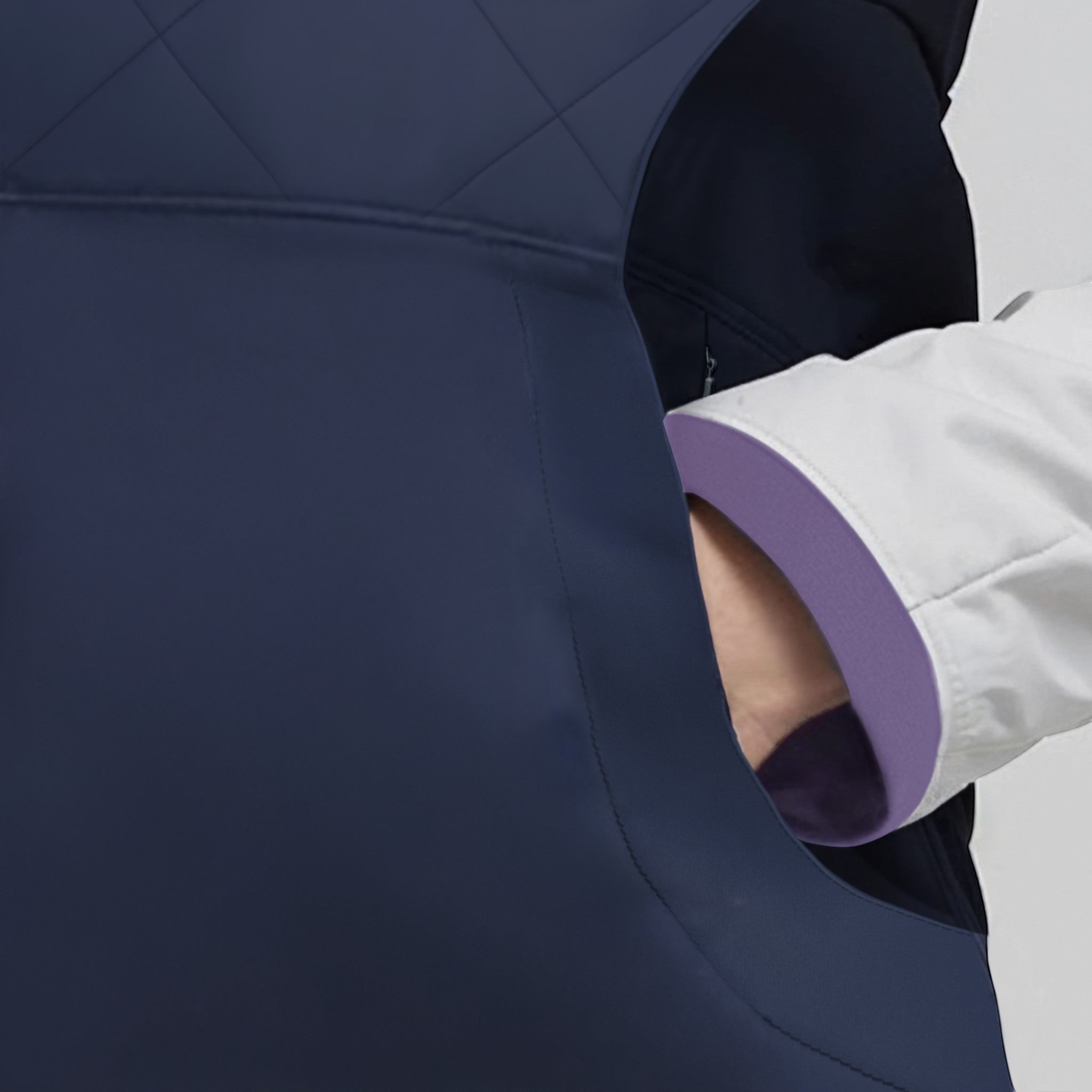 Elliott & Rose navy quilted golf vest with diamond pattern and side panels for movement.
