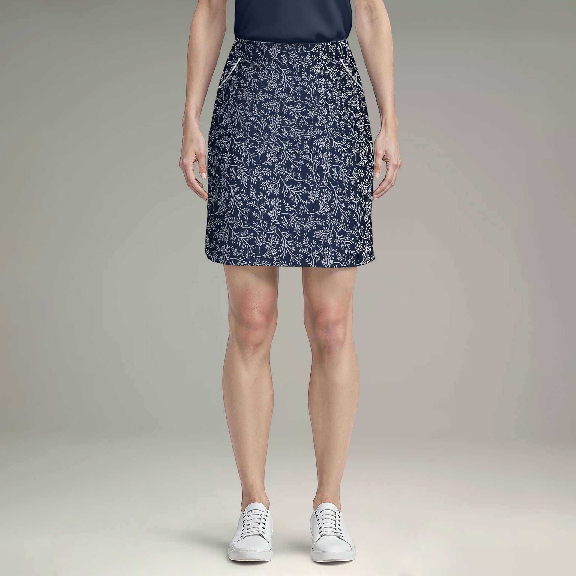 Elliott & Rose navy skort with white vine print, lightweight fabric, and flattering cut for golf.