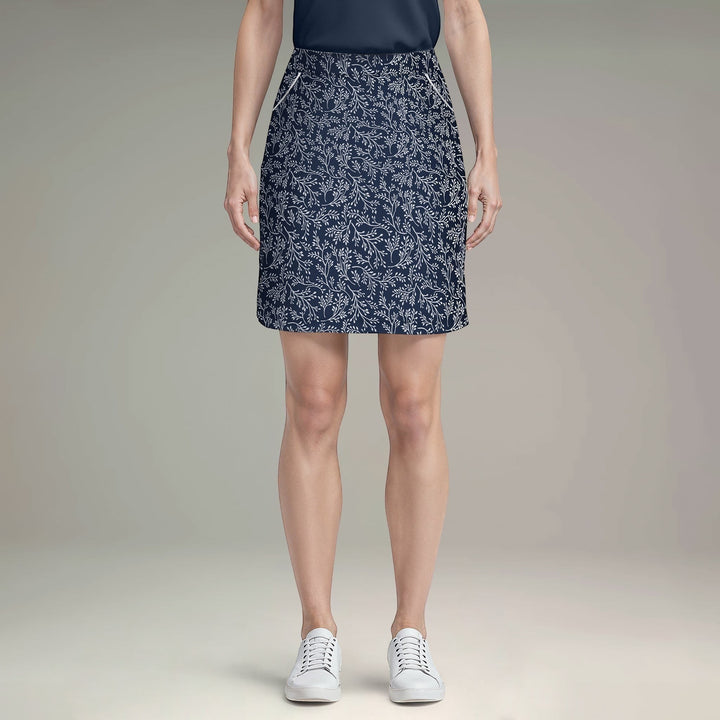 Elliott & Rose navy skort with white vine print, lightweight fabric, and flattering cut for golf.