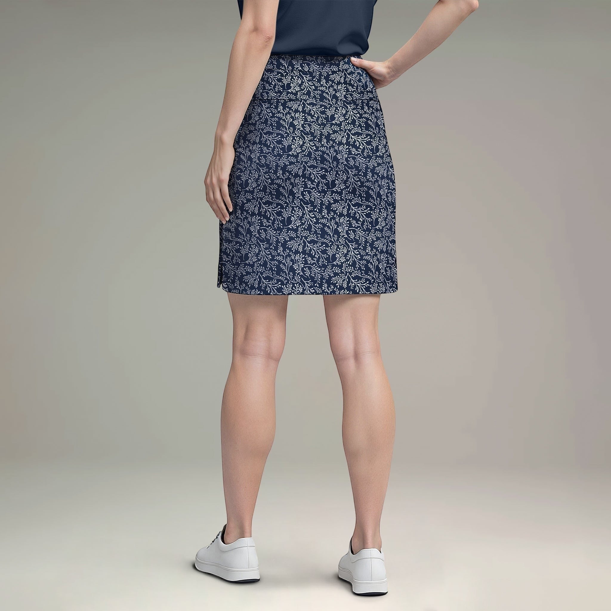 Elliott & Rose navy skort with white vine print, lightweight and comfortable for golf.