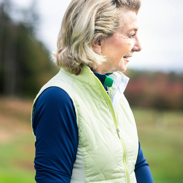 Elliott & Rose quilted chartreuse golf vest with full-zip front and stand-up collar.