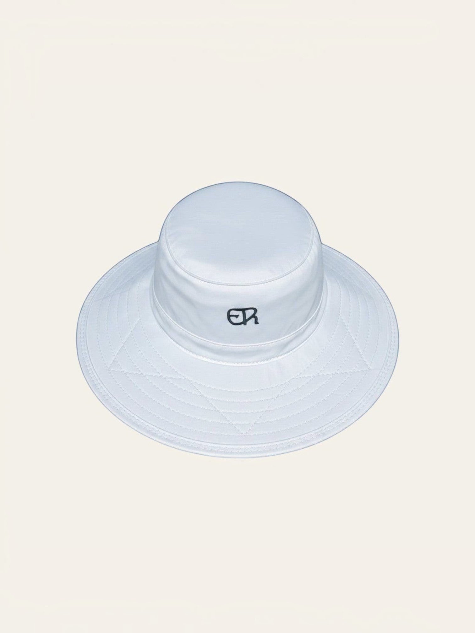 Elliott & Rose white nylon bucket hat with green ER logo and stitched brim, UPF 50+ protection.