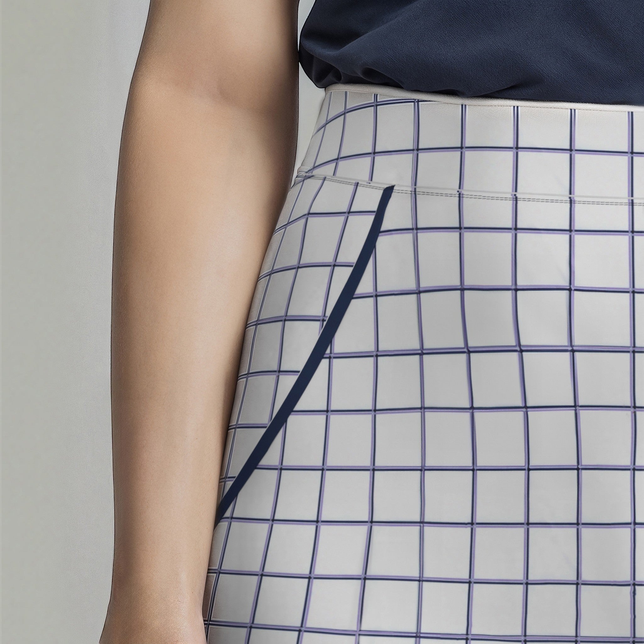Elliott & Rose white windowpane golf skort with navy trim and elasticized waist. Tailored fit for comfort and mobility.