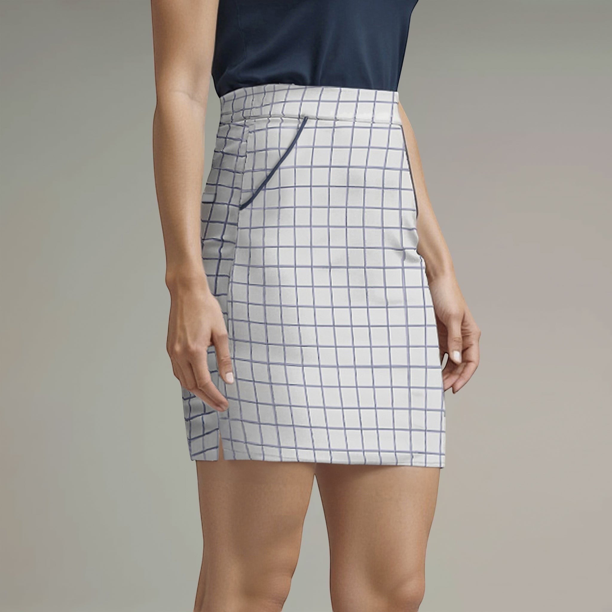 Elliott & Rose white windowpane golf skort with navy trim and four pockets.