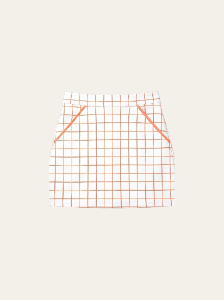 Elliott & Rose tangerine and white windowpane golf skort with an elastic waistband and built-in shorts.
